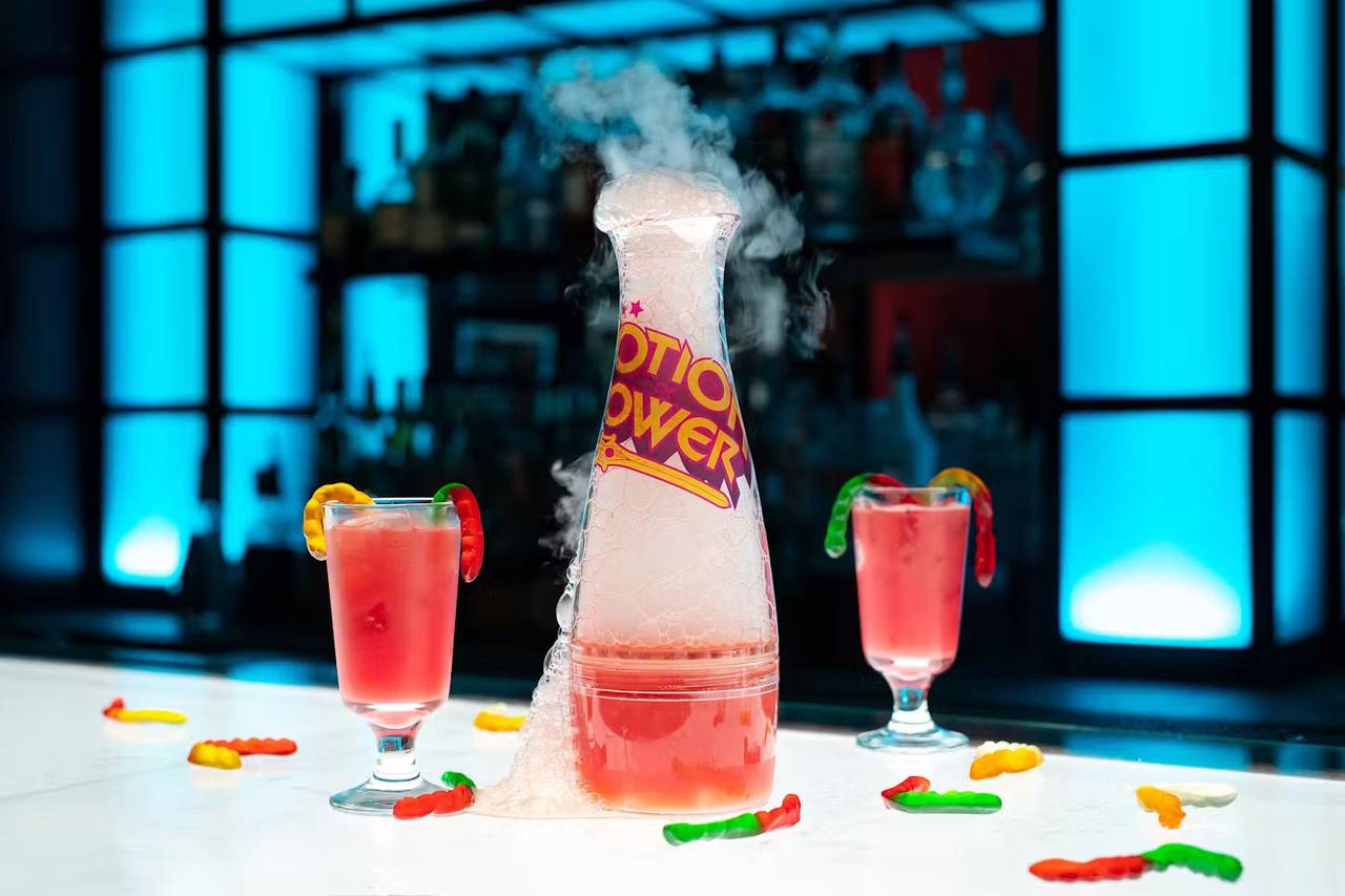 A smoking Potion Power cocktail with gummy-worm shots at Storm Crow Manor