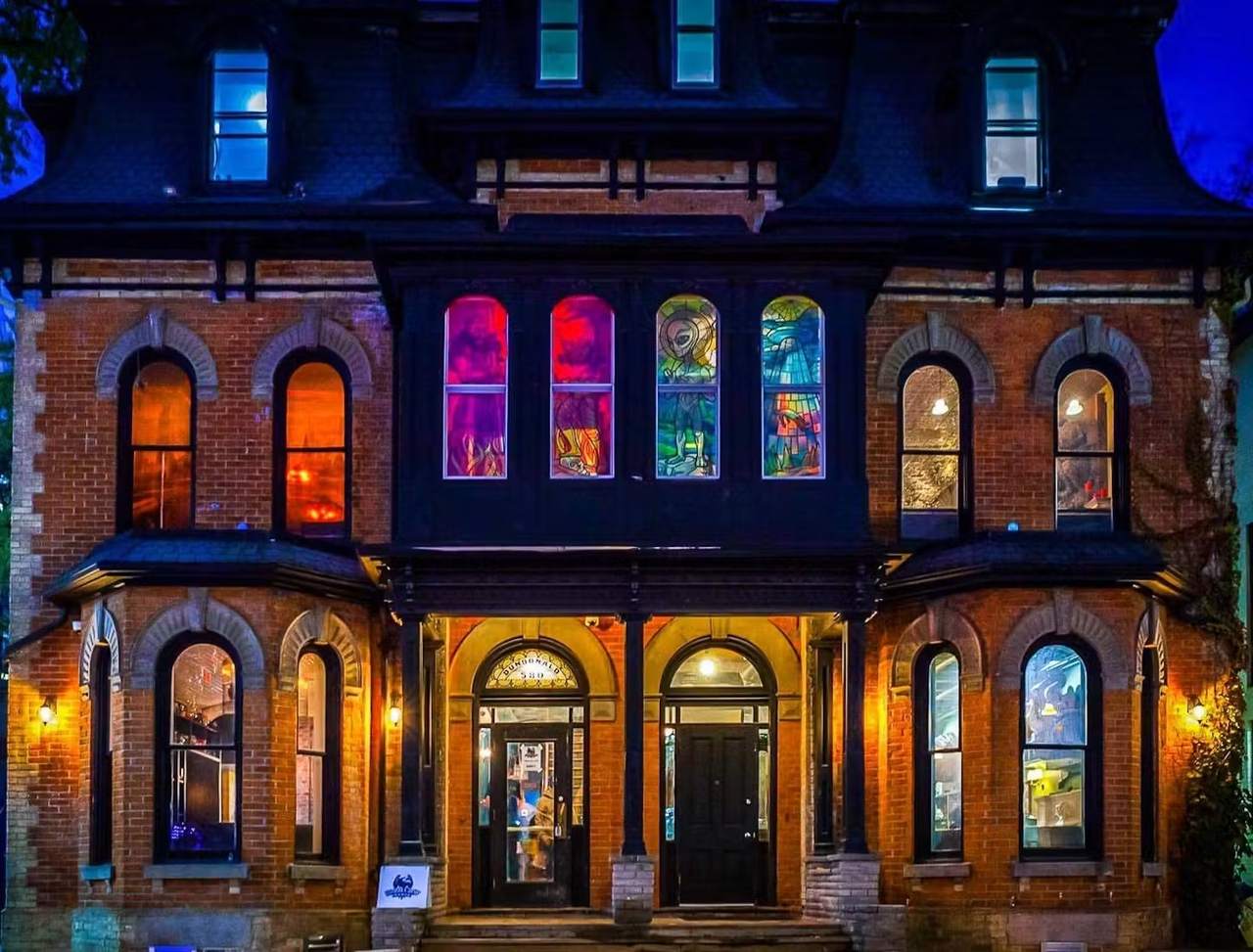 Storm Crow Manor — the Victorian mansion at 580 Church Street, lit up at night